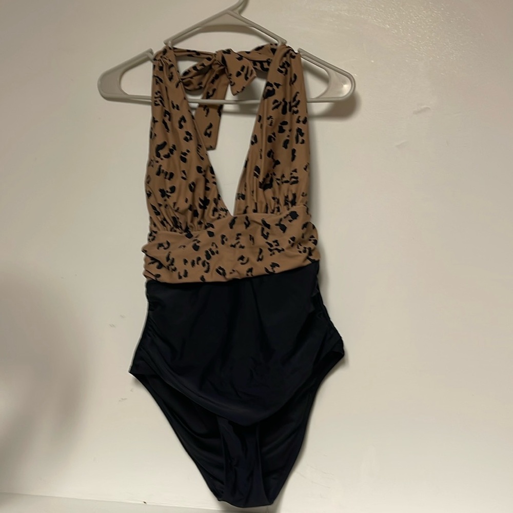 Leopard print halters tummy fitting swimsuit. Size Mesium. Gently use. No flaws.